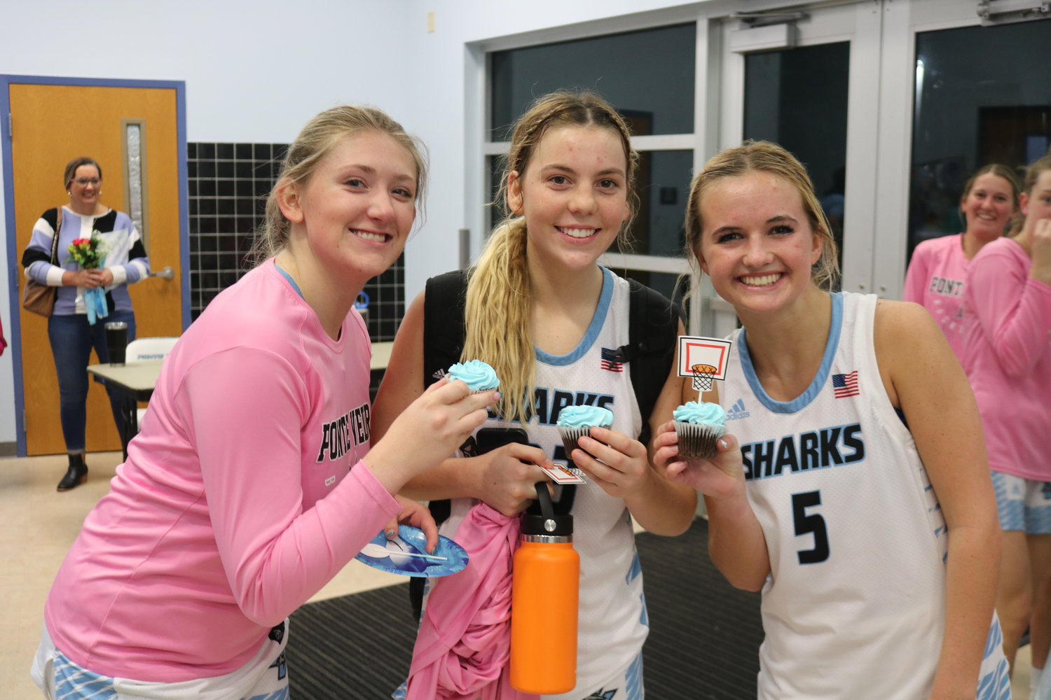 Ponte Vedra seniors Parker Peverley, Paige Hulihan and Reeghan Mayer enjoy some cupcakes following a big victory on senior night.